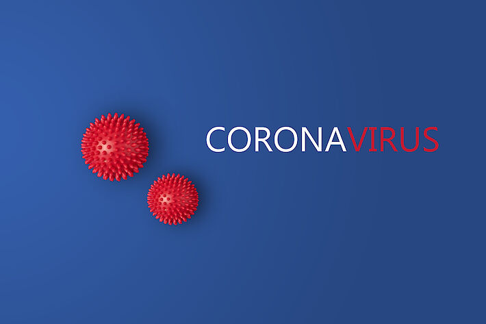 Plakat mit zwei Corona-Viren